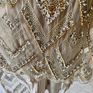 Elegant strapless form fitting full length sequins design gown